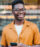 Shot of handsome african-american young man with smart phone texting outdoors in the city.